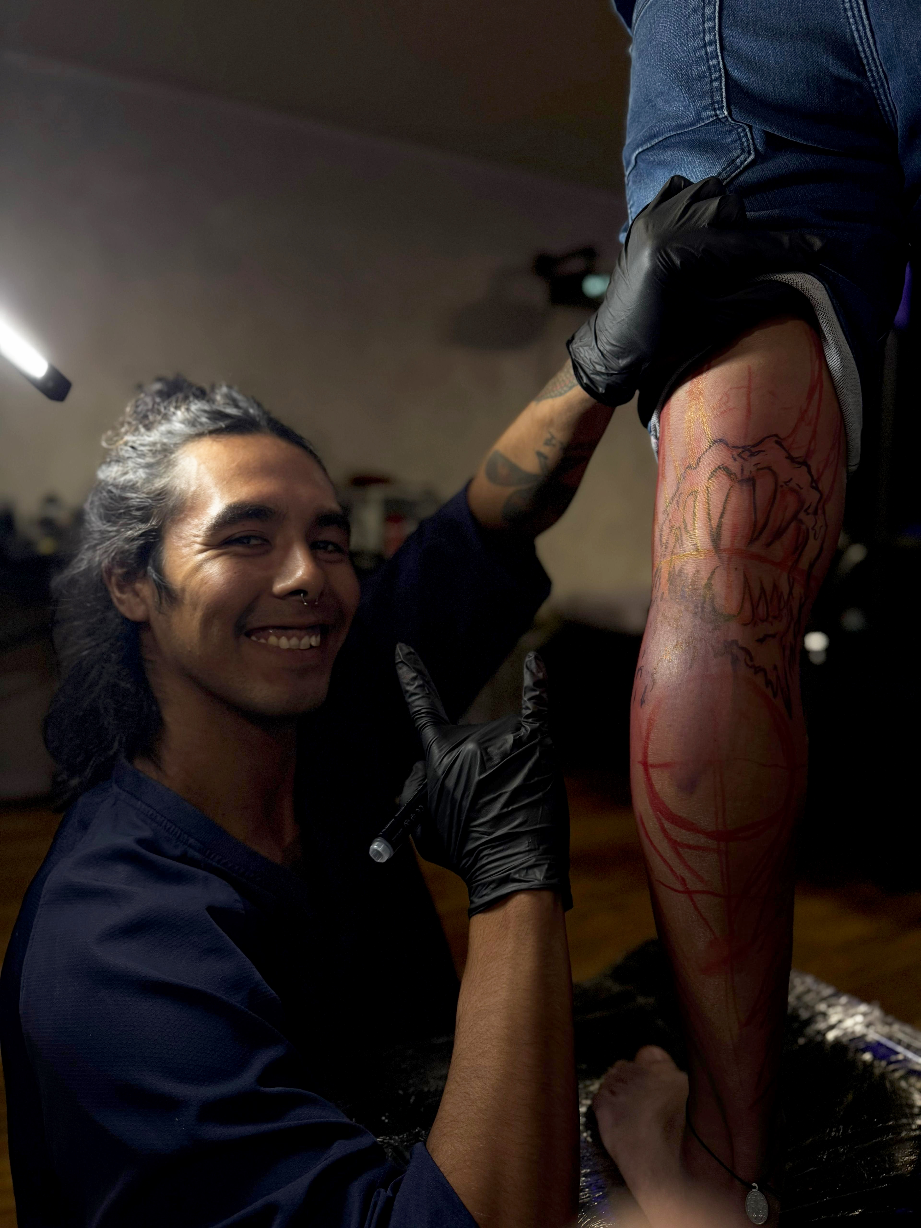 Ferlucy tattooing directly on a client's body