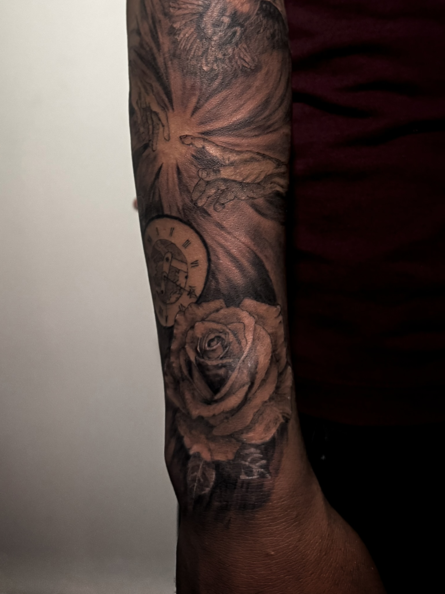 Rose and clock sleeve with deep tonal shading
